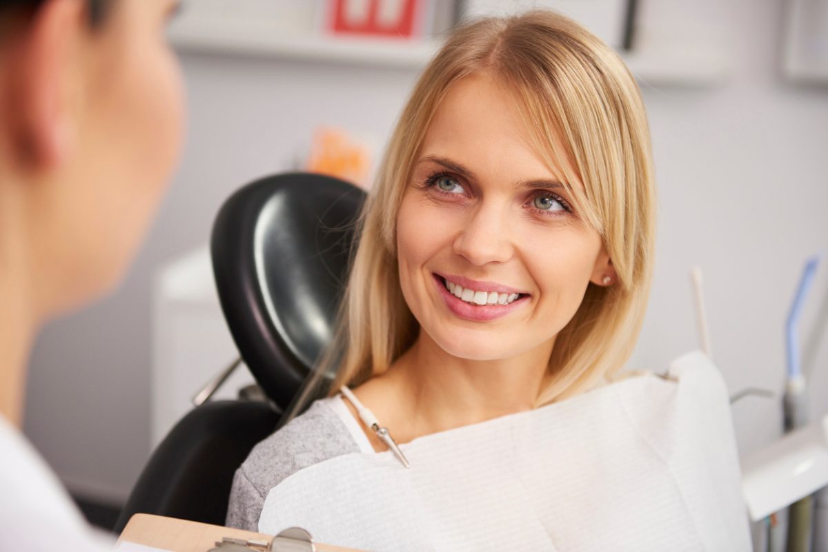 concept of person asking questions at cosmetic dentist